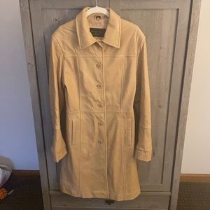 Beautiful butter soft knee length leather coat with fur collar. Never worn.